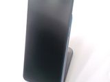 a cell phone that is sitting on top of a stand