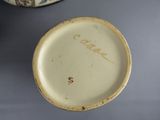 a white plate with writing on it sitting on a table