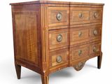 a wooden chest of drawers with many drawers on it