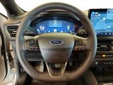 the interior of a car with a steering wheel and dashboard controls