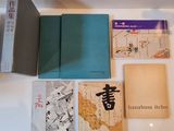 many books on the table with asian writing on them