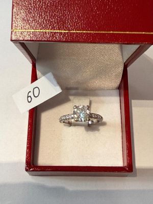 an image of a diamond ring in a red box with a price tag