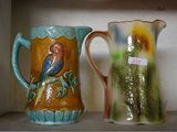 two vases that are sitting on a shelf
