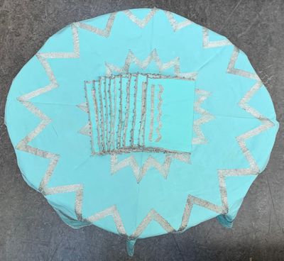 a blue table with a basket on top of it