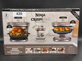 boxed box of ninja crispi pro with chicken and vegetables in it