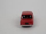 a red toy car that is sitting on a white surface