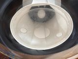 an overhead view of a kitchen sink with a bowl on it