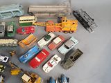 a lot of toy cars and trucks on a table