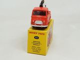 a red toy truck sitting on top of a yellow box
