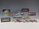 a lot of cars that are on display in a display case