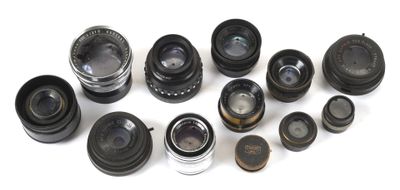many different types of camera lenses on a white surface