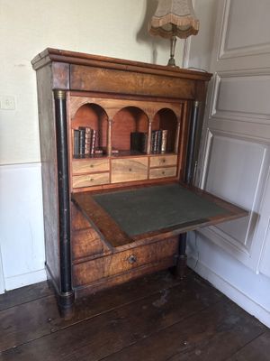 a wooden desk with a book shelf on top of it