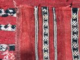 a close up view of a red and black blanket