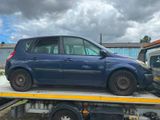 a blue car on the back of a flatbed truck