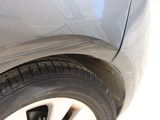 a close up of a car ' s tire on the road