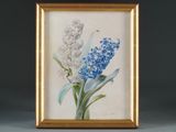 painting of blue and white flowers in a gold frame on a gray surface