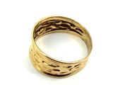 an image of a close up of a gold ring on a white surface