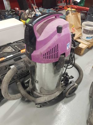 a vacuum that is sitting on a table in a room