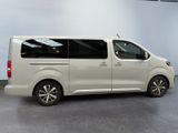 the white van is parked in the garage with its doors open