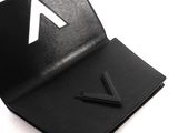 leather business card case with a triangle cut out of it