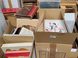 many boxes of books stacked on top of each other