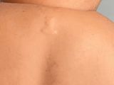 a close up of the back of a man ' s neck