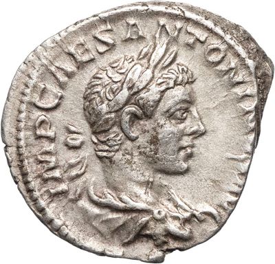 Pièce d'argent portant l'image d'un homme portant une couronne.