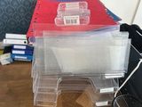 a stack of binders and a keyboard on a desk