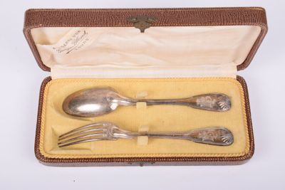 a silverware set in a case with a spoon and fork