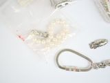 a bag of beads and a keychain on a table