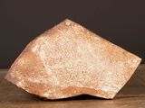a large piece of stone on a wooden table