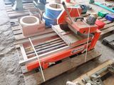 a machine that is sitting on top of a pallet