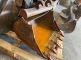 a large metal excavator that is sitting on a pallet