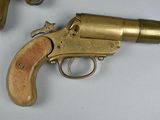 two revolvers that are on a table next to each other