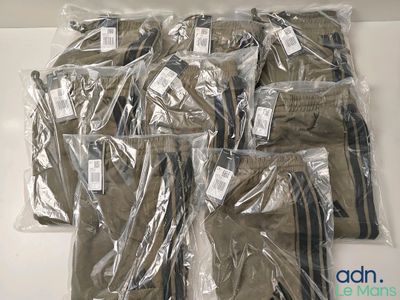 a lot of men ' s pants that are wrapped in plastic