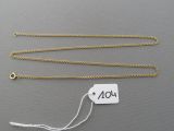 a close up of a gold chain with a price tag on it