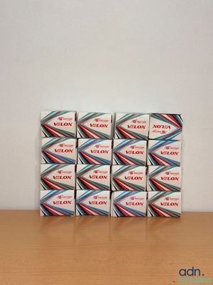 several boxes of condoms sitting on top of a wooden table