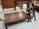 several pieces of furniture are sitting in a room with a piano