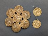 a close up of a bunch of gold coins on a table