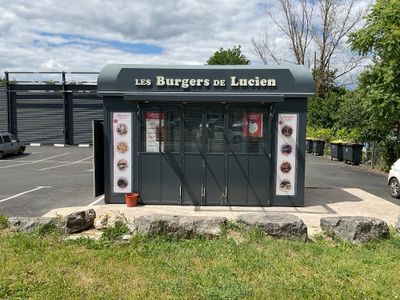 a small restaurant with a lot of menus on the front
