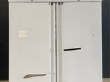 a picture of a white refrigerator with two doors