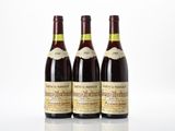 three bottles of wine sitting next to each other on a table