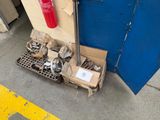 a fire extinguisher next to a box of tools on the ground
