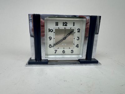 a small clock that is sitting on a table