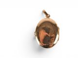 a close up of a gold locke on a white background