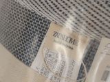 a close up of a mesh bag with a label on it