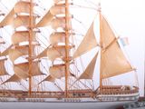 a model of a sailboat on display on a table