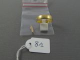a picture of a pair of rings and a price tag on a table
