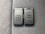 two remote controls on the back of a car