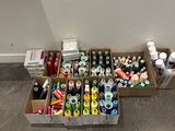 many cans and cans of paint on the floor
